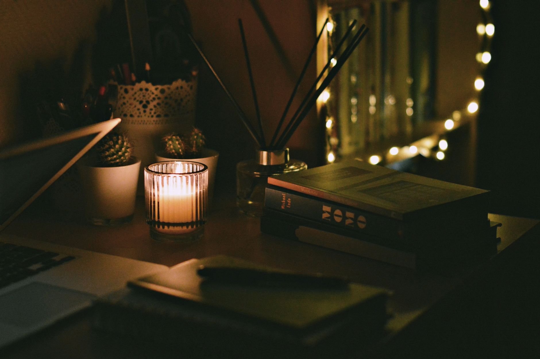 A cozy warm study environment with books and laptop